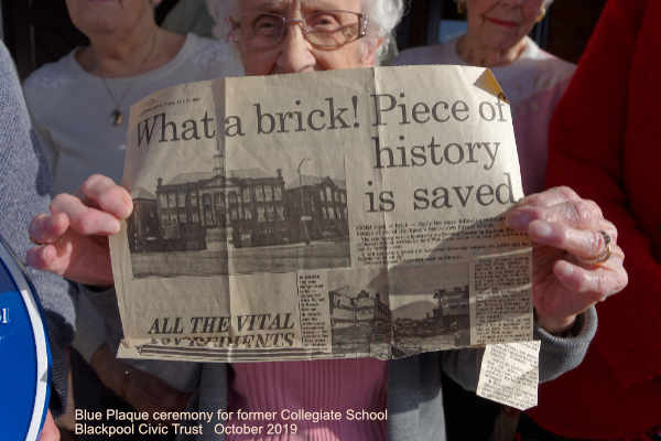 Resident with newspaper cutting of Colegiate School Blackpool