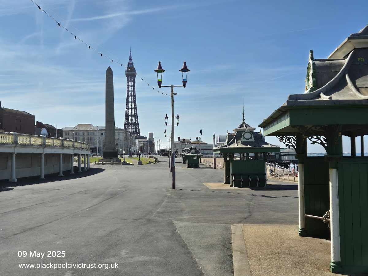 Blackpool Cenotaph with Blackpool Tower and promenade shelters.